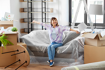 Image showing happy asian woman with stuff moving to new home