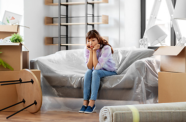 Image showing sad asian woman with stuff moving to new home