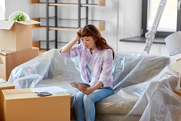 Image showing asian woman moving to new home and counting money