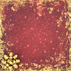 Image showing Christmas and New Year Gold Bow Abstract Background on Red