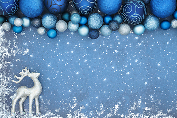 Image showing Christmas Background with Reindeer and Sparkling Blue Tree Decor