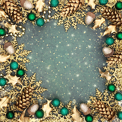 Image showing Christmas Festive Gold Snowflake and Green Bauble Background