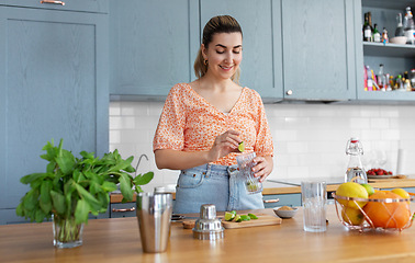 Image showing woman making cocktail drinks at home kitchen