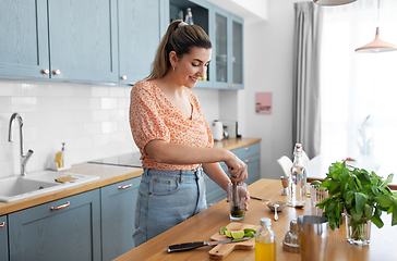 Image showing woman making cocktail drinks at home kitchen