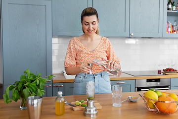 Image showing woman making cocktail drinks at home kitchen