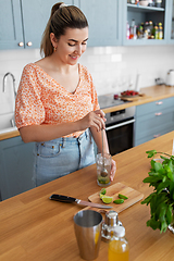 Image showing woman making cocktail drinks at home kitchen