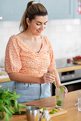 Image showing woman making cocktail drinks at home kitchen