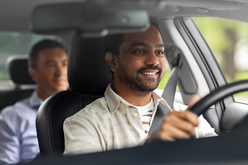 Image showing indian male driver driving car with passenger