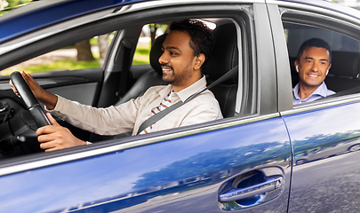 Image showing indian male driver driving car with passenger