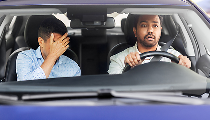 Image showing car driving school instructor and male driver