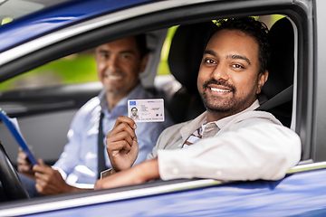 Image showing car driving instructor and driver with license