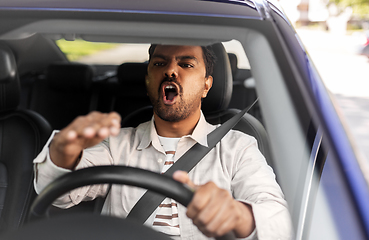 Image showing angry indian man or driver driving car