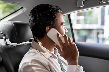 Image showing male passenger calling on smartphone in taxi car