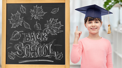 Image showing little student girl in bachelor hat or mortarboard