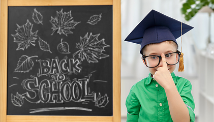 Image showing little student boy in bachelor hat and eyeglasses