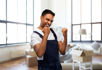 Image showing happy worker celebrating success at new home