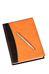 Image showing Diary and pen on table isolated