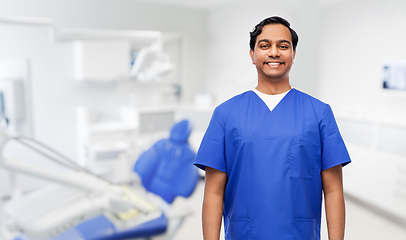 Image showing happy indian doctor or dentist at dental office