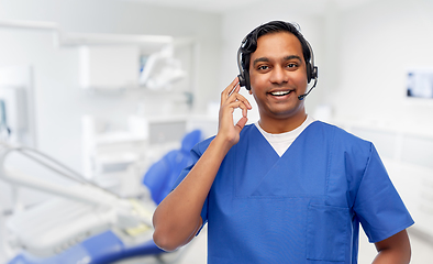 Image showing indian doctor with headset at dental office