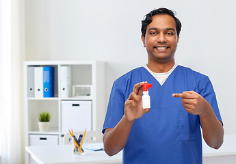 Image showing smiling indian male doctor or nurse with medicine