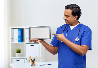 Image showing happy doctor or male nurse showing tablet computer