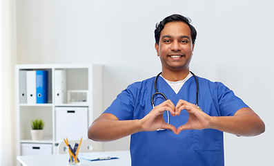 Image showing indian doctor with stethoscope showing hand heart