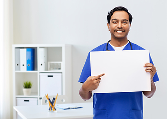 Image showing smiling male doctor or nurse with white board