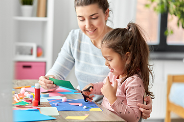 Image showing daughter with mother making applique at home