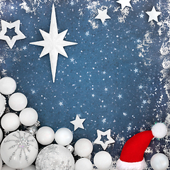 Image showing Magical Christmas Eve Background with Santa Hat and Baubles