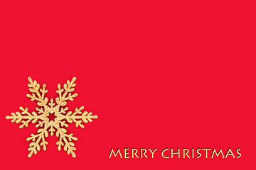 Image showing Merry Christmas Gold Glitter Snowflake on Red Background