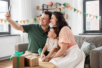 Image showing happy family taking selfie on birthday at home