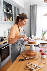 Image showing woman cooking food and baking on kitchen at home