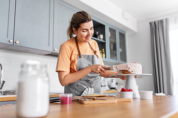 Image showing woman cooking food and baking on kitchen at home