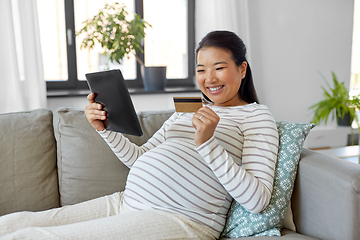 Image showing pregnant woman with tablet pc and credit card