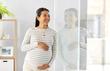 Image showing happy pregnant asian woman at home