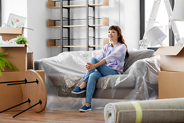 Image showing happy asian woman with stuff moving to new home