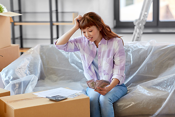 Image showing asian woman moving to new home and counting money