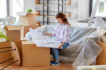 Image showing woman with blueprint and boxes moving to new home