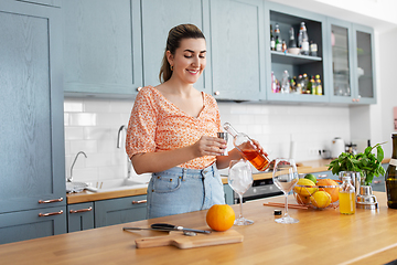 Image showing woman making cocktail drinks at home kitchen