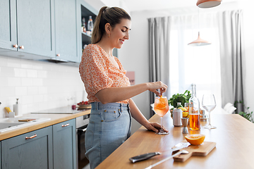 Image showing woman making cocktail drinks at home kitchen