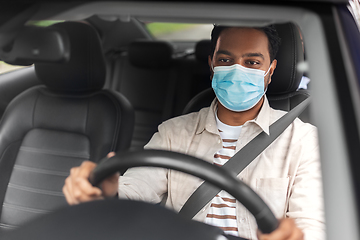 Image showing indian male driver in mask driving taxi car