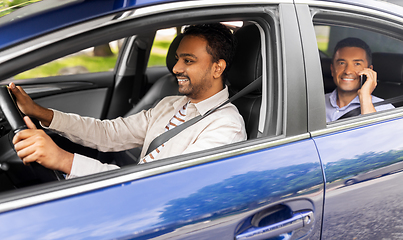 Image showing male passenger calling on smartphone in taxi car