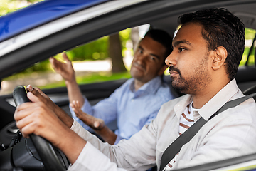 Image showing car driving instructor talking to man failed exam