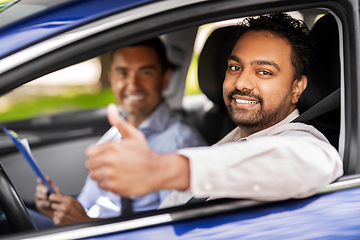 Image showing smiling driver and car driving school instructor