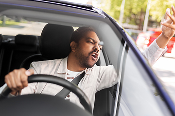 Image showing angry indian man or driver driving car