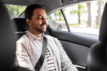 Image showing smiling indian male passenger in taxi car