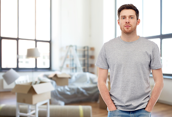 Image showing young man in gray t-shirt at new home