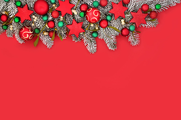 Image showing Christmas Fir Snow and Tree Bauble Red Background Border 