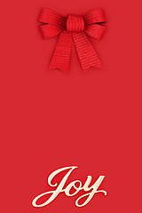 Image showing Joy at Christmas and Festive Red Bow Background