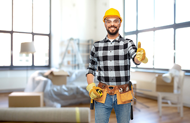 Image showing happy male builder showing thumbs up at home